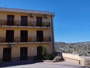 a building with balconies on the side of it at Ferula loft in Sortino