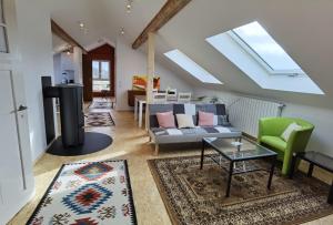 a living room with a couch and a stove at Haus Waldeck in Ühlingen-Birkendorf