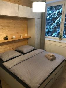 Postel nebo postele na pokoji v ubytování #Apt23 - Apartmán 23 - Novohradské hory