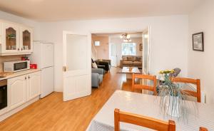 a living room with a kitchen and a dining room at Two bedroom townhouse in the heart of Dungarvan in Dungarvan
