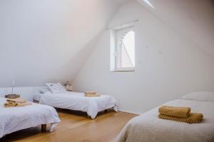 Postel nebo postele na pokoji v ubytování Viktoria Guesthouse