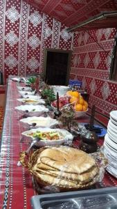 a long table with plates of food on it at Star Wars Wadi Rum in Wadi Rum