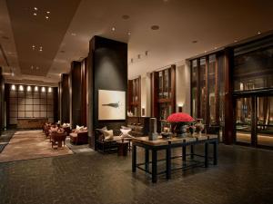 a lobby of a hotel with a table and chairs at The Setai, Miami Beach in Miami Beach