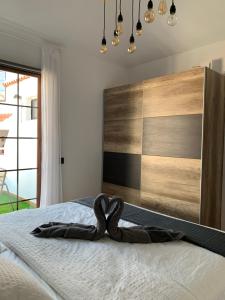 Ένα ή περισσότερα κρεβάτια σε δωμάτιο στο Luxury Los Diamantes One Bedroom Apartment
