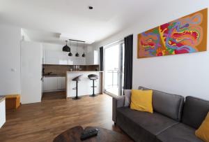 A kitchen or kitchenette at MK Apartment FREE Parking