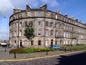 a large stone building on a city street at 1 Bellevue Terrace in Edinburgh
