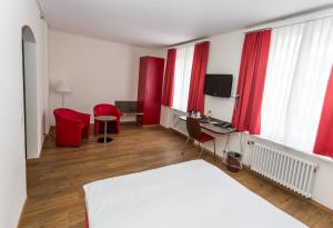 Televiisor ja/või meelelahutuskeskus majutusasutuses Sorell Hotel Arabelle