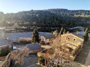 an aerial view of a village with a river at Refugi MARILLUNA in Montblanquet