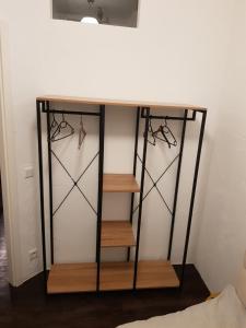 a dressing table with three shelves and a table at Deutzer Freiheit in Cologne