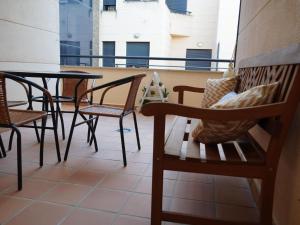 a balcony with chairs and a table on a balcony at Cozy holiday home in a charming area in Montilla
