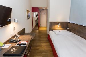 Voodi või voodid majutusasutuse Sorell Hotel Arabelle toas