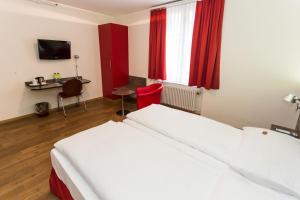 Voodi või voodid majutusasutuse Sorell Hotel Arabelle toas