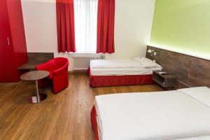 Voodi või voodid majutusasutuse Sorell Hotel Arabelle toas