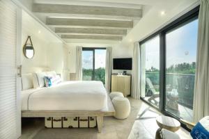 Postel nebo postele na pokoji v ubytování Naay Boutique Hotel Holbox