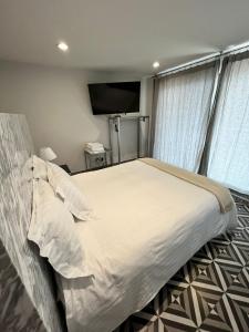 Cama o camas de una habitación en Suites Casa Mateo San Miguel Allende
