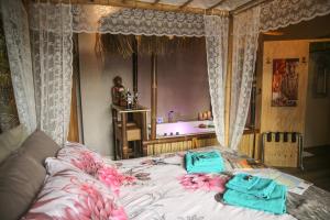 Postel nebo postele na pokoji v ubytování B&B de Hartewens