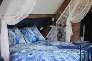 Postel nebo postele na pokoji v ubytování B&B de Hartewens