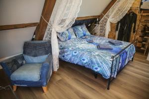 Postel nebo postele na pokoji v ubytování B&B de Hartewens
