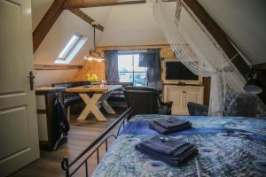 Postel nebo postele na pokoji v ubytování B&B de Hartewens