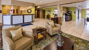 a lobby of a hospital with chairs and a table at SureStay Plus Hotel by Best Western Buckhannon in Buckhannon