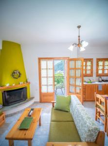 A seating area at Olive House in Damouchari with a sea view - Delicious Houses