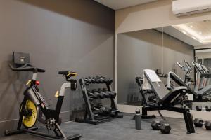 a gym with tread machines and a mirror at Sonder Onyx in Philadelphia