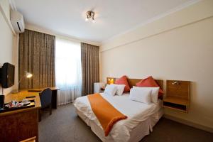 Hotel Thuringerhof tesisinde bir odada yatak veya yataklar