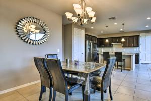 a dining room and kitchen with a table and chairs at Spacious Gilbert Vacation Rental with Patio! in Gilbert
