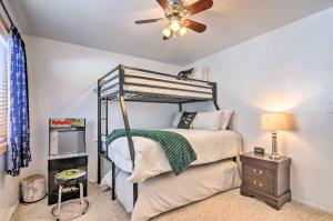 a bedroom with a bunk bed and a ceiling fan at Peaceful Utah Ski-InandSki-Out Vacation Rental! in Beaver