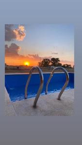a view of a pool with two metal handles at Camino al Sol Domselaar wifi in Domselaar +17 photos