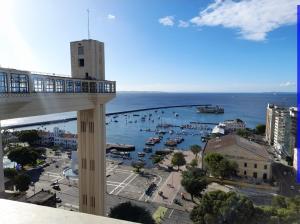 a view of a harbor with boats in the water at Perto do Pelourinho Quarto Arejado in Salvador