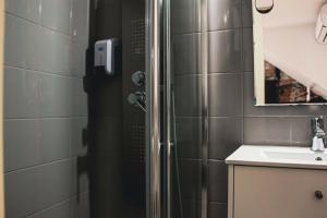 a bathroom with a shower and a sink at Hannah's Studios in Porto +61 photos