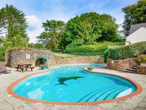 a swimming pool with a shark in the middle at Barley Cottage in Brownston