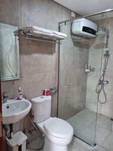 a bathroom with a shower and a toilet and a sink at Amazing view 2 bedrooms new apartment in Batam Center