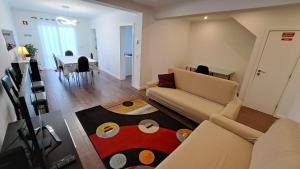 a living room with a couch and a table at Hamilton House in Vila Franca do Campo