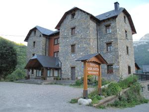 a large stone building with a sign in front of it at Hotel Casa Anita in San Juan de Plan