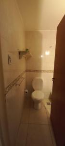 a bathroom with a white toilet in a room at Departamentos Centro Dpto 6 1 habitacion in Tandil