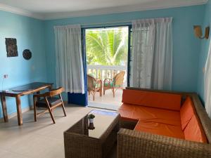a living room with a couch and a table at Villa Blue Lagoon in Sihanoukville