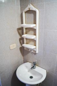 a bathroom with a sink and a mirror at Nativo Kite House in La Boquilla