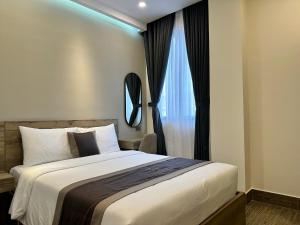 Giường trong phòng chung tại LION 5 HOTEL