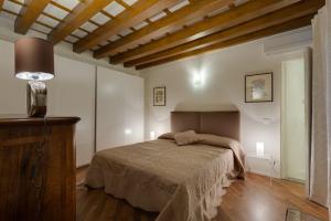 Posteľ alebo postele v izbe v ubytovaní Apartments Florence - Vigna Nuova Alberti