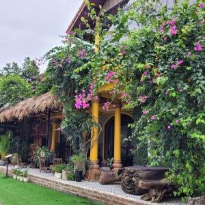 a house with flowers on the front of it at Amazing View Homestay in Ninh Binh