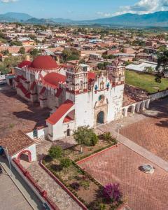 an aerial view of a building in a city at LÍZU Tu casa en un pueblo zapoteca in Teotitlán del Valle +37 photos