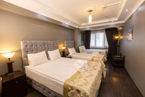 Postel nebo postele na pokoji v ubytování Cumbali Luxury Boutique Hotel