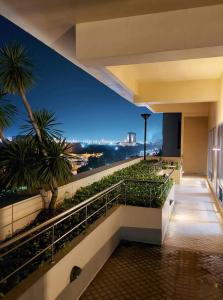 a building with a view of the city at night at Comfy Condo Grand Riviera Suite, Roxas Blvd Ermita Manila infront of US Embassy in Manila