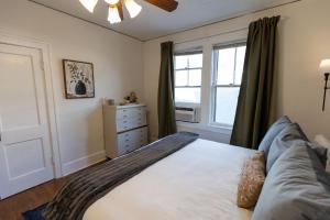 a bedroom with a large bed and a window at Historic Revival King Bed Midtown Memphis 68 Yes Pets Fast Wifi Free Parking in Memphis