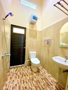 Koupelna v ubytování Al-Kiswah Syariah Guest House