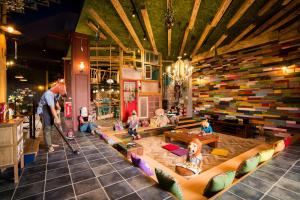 a group of people sitting on couches in a room at Fly Inn 飛旅宿 in Dongshan