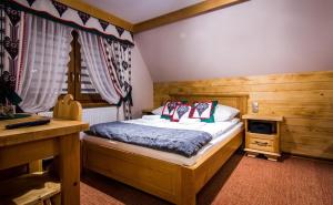 Postel nebo postele na pokoji v ubytování Apartamenty u Stopków