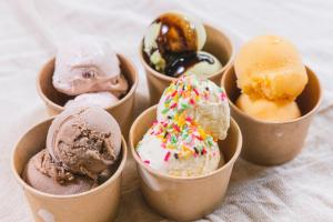 a group of four cups filled with different types of ice cream at HOTEL RELIEF Namba Daikokuchou in Osaka